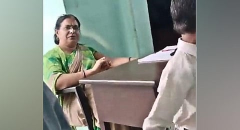 A screen grab of the video in which the teacher, Tripti Tyagi, was caught asked her students to slap their Muslim classmate. (Photo | Twitter)