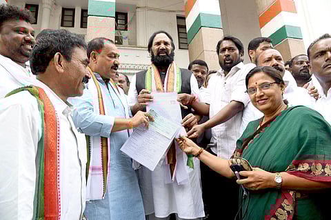 Nalgonda MP N Uttam Kumar Reddy submitting applications for Kodad and Huzurnagar Assembly constituencies. (Photo | Express)