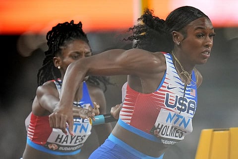 Alexis Holmes and Quanera Hayes, of the United States fail to make the final baton handover during the World Athletics Championships, Aug 26, 2023. (Photo | AP)