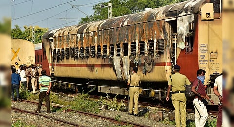 Security personnel at the spot after a fire broke out in a coach of a train at Madurai railway station, Aug 26, 2023. (Photo | PTI)