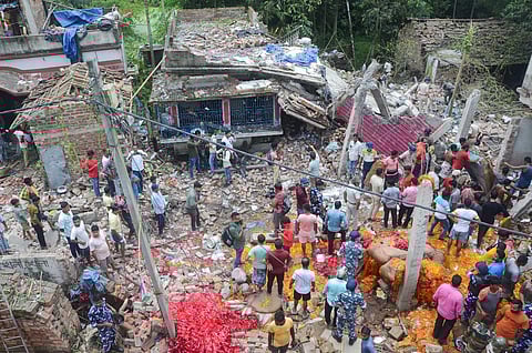 People and security personnel gather after a blast at an illegal firecracker factory in North 24 Parganas district, Aug 27, 2023. (Photo | PTI)