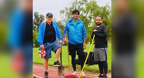 Gold medalist Neeraj Chopra (C) with his coach Klaus Bartonietz (L).