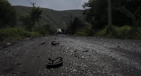 A sandal lies on a road next to scattered glass from vehicles vandalized during communal clashes in Nuh in Haryana state, India, Tuesday, Aug. 1, 2023. (Photo | AP)