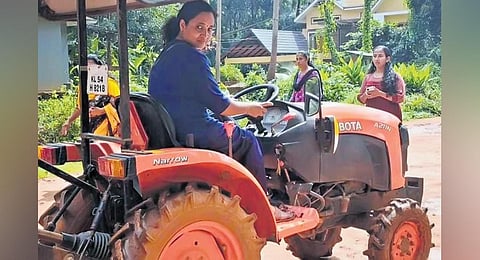 A woman engaged in tractor training at Panthalayani in Kozhikode. (Photo | Express)