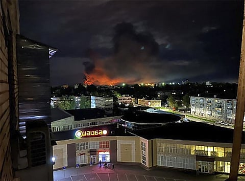 Smoke billowing over the city and a large blaze in Pskov, Russia, on Aug. 29, 2023. (Photo | AP)