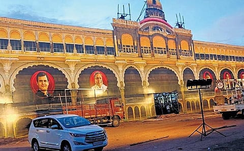 A huge entrance resembling the Amba Vilas Palace erected at the venue for the launch of the Gruha Lakshmi scheme in Mysuru on Tuesday | Express