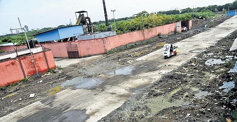Concrete slabs have been placed on the canal connecting Chinna Mathur lake with Kosasthalaiyar river to create a pathway to the burial ground in Manali | P Ravikumar