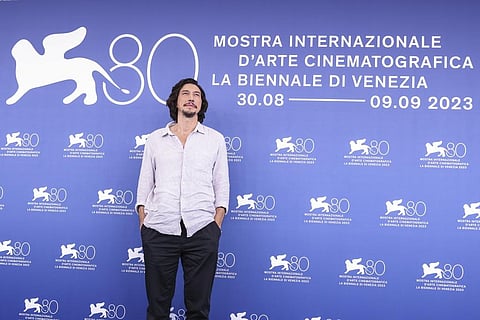 Adam Driver poses for photographers during the photo call for the film 'Ferrari' during the 80th edition of the Venice Film Festival. (Photo |AP)