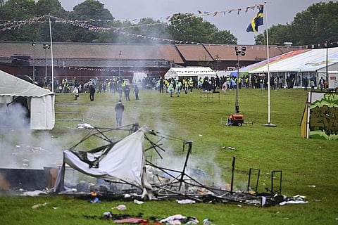 Smoke billows from a burning tent at the Eritrean cultural festival 'Eritrea Scandinavia' in Stockholm, Thursday, Aug. 3, 2023. (AP)