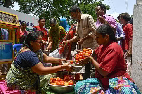 Citizens throng vegetable market to purchase Tomatoes at subsidised prices in Vijayawada on Thursday. (Photo | Prasant Madugula)