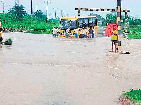 A bus gets stuck in floodwater on a road in Bhalulata under Bisra block | Express