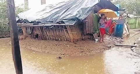 A boy stands outside his house as flood water recedes in Kalahandi’s Madanmohanpada; (Right) Traffic between Kosoka to Adakata village under Khandapada block in Nayagarh district hit as an old bridge