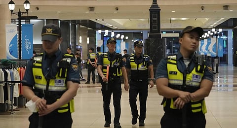 Police officers cordon off the scene near a subway station in Seongnam, South Korea. (Photo | AP)