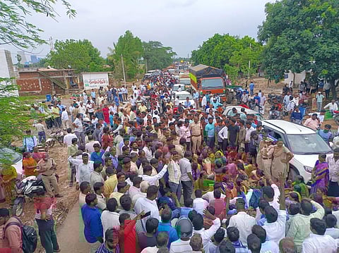 Moranchapalle villagers staged a protest on the Warangal-Jayashankar Bhupalapally Highway on Thursday. (Photo | Express)