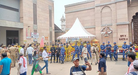 Security personnel stand guard outside the Gyanvapi mosque as a team of the Archaeological Survey of India (ASI) conducts a scientific survey at the mosque complex.(Photo | PTI)