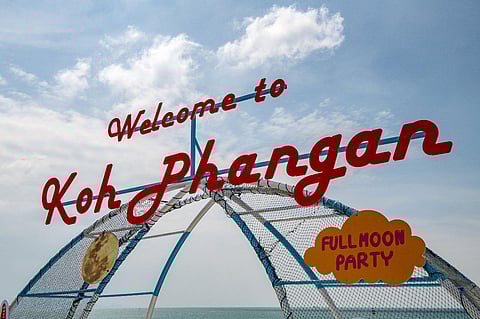 This file photo taken on November 28, 2021 shows a welcome sign at a pier on Koh Pha Ngan in the Gulf of Thailand. (Photo | AFP)