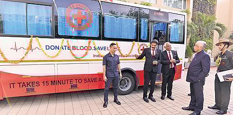 Governor S Abdul Nazeer flagging off two mobile blood collection buses of IRCS AP State Branch in Vijayawada on Friday I Express