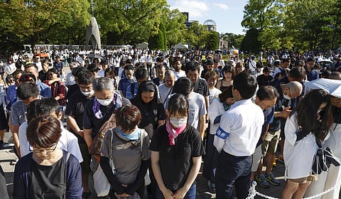 Visitors observe a moment of silence during a ceremony marking the 78th anniversary of the world's first atomic bombing at the Hiroshima Peace Memorial Park in Hiroshima. (Photo | AP)
