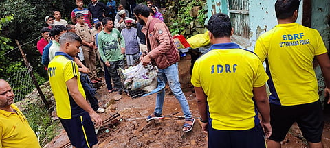 SDRF officials during the rescue operations at the spot where a wall collapsed on two children and an adult in Maroda village, Aug 6, 2023. (Photo | Express)