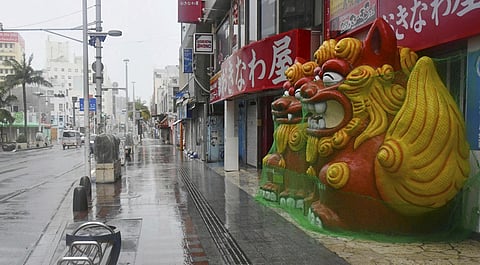 A main street is deserted as Typhoon Khanun approaches Naha city, Okinawa prefecture, southern Japan. (Photo | AP)
