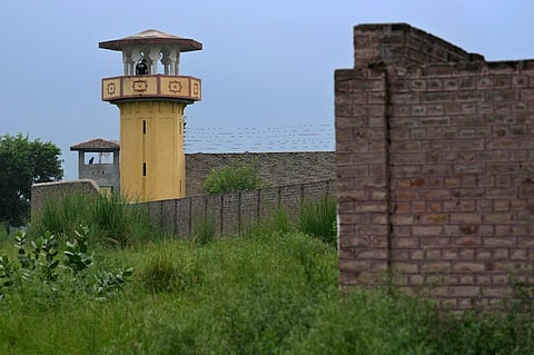 Police officers stand guard on the watch towers of district prison Attock, where Pakistan's former Prime Minister Imran Khan in-prison after his conviction. (Photo | AP)