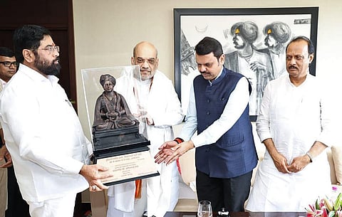 Union Home Minister Amit Shah being felicitated by Maharashtra CM Eknath Shinde and Deputy CMs Devendra Fadnavis and Ajit Pawar on his arrival, in Pune on Sunday. (Photo | ANI)