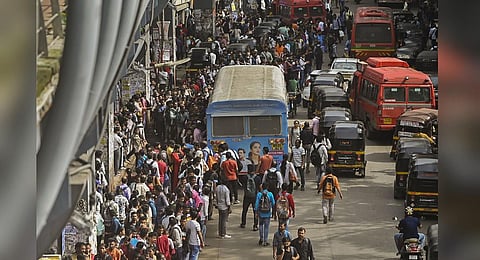 Commuters wait for buses at a stop during a strike called by drivers of private bus operators, at Andheri in Mumbai. (Photo | PTI)