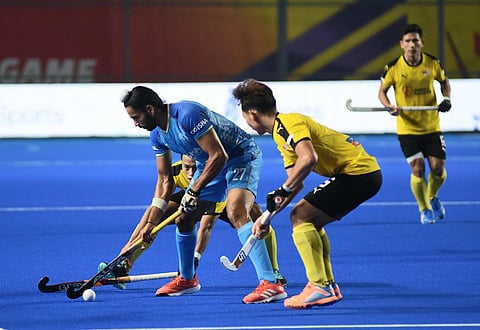India have climbed to the top of the Asian Champions Trophy table with a resounding 5-0 win over Malaysia on Sunday at the Mayor Radhakrishnan stadium.