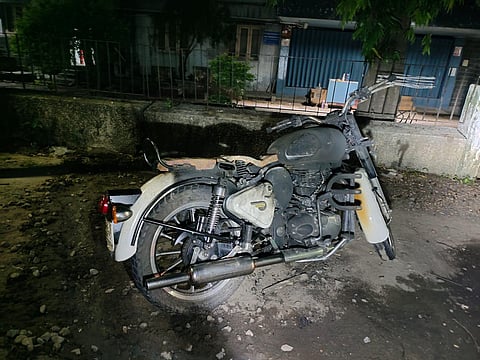 A motorist fell down after he got struck by a dangling wire, near Pushpa Hotel centre in Vijayawada city. (Photo | Express)
