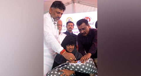 Deputy CM DK Shivakumar administers vaccine to an infant in Bengaluru  on Monday | Shashidhar Byrappa