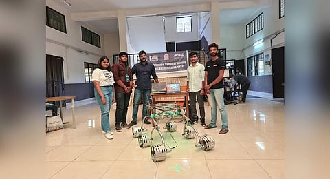Cusat students with a concept-stage model of the rover.