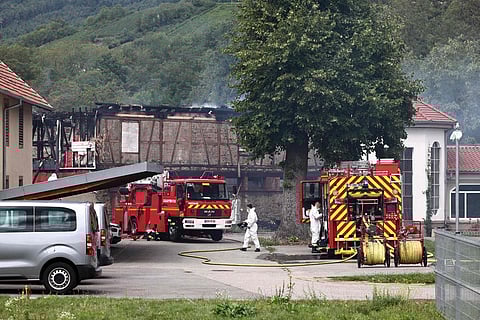 Firefighters work at the site of a fire which erupted at a holiday home for disabled people in Wintzenheim, eastern France, on August 9, 2023. (Photo | AFP)