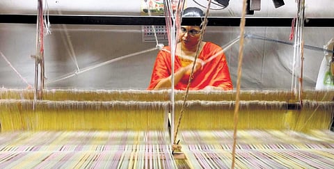 K Bindu, a weaver of Lokanath Weavers, working on the fabric for the ‘Onakodi’