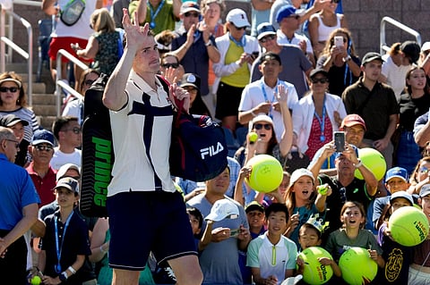 John Isner reacts after losing to Michael Mmoh, during the second round of the U.S. Open tennis championships. (Photo | AP)