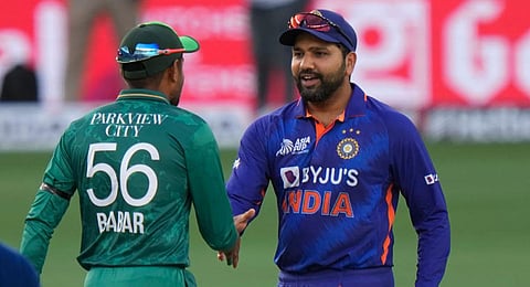 India's captain Rohit Sharma shakes hands with his Pakistani counterpart Babar Azam (File photo | AFP)