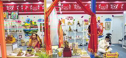 Artisans at a stall at the G20 Crafts Bazaar, an exhibition/sale, during the G20 Summit at the Bharat Mandapam, in New Delhi on Saturday | pti