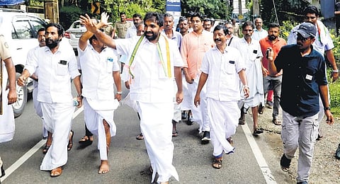 Chandy Oommen waves at people at Vakathanam in Kottayam, during his ‘padayathra’ to thank voters of Puthuppally. (Photo | Express)
