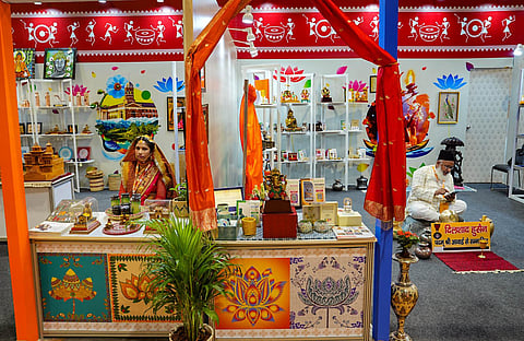 Artisans at a stall at the G20 Crafts Bazaar, an exhibition-cum-sale, during the G20 Summit at the Bharat Mandapam, in New Delhi, Saturday, Sept. 9, 2023. (PTI)