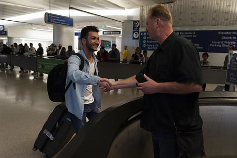 Michael White and Mahdi Vatankhah. (Photo | AP)