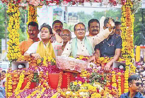 Chief Minister Shivraj Singh Chouhan with Union minister Jyotiraditya Scindia  during a roadshow in Gwalior, on Sunday | PTI