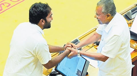 Chief Minister Pinarayi Vijayan congratulates Chandy Oommen who took oath as MLA in the assembly on Monday. (Photo | xpress)