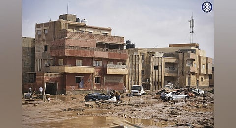 In this photo provided by the Libyan government, cars and rubble sit in a street in Derna, Libya. (Photo | AP)