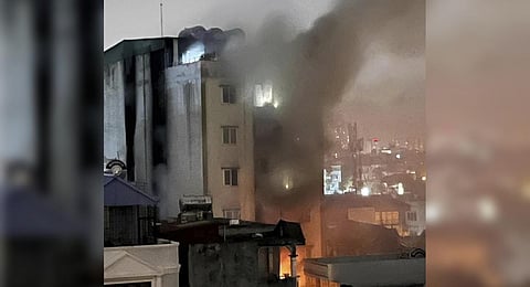 Smoke rises from a building in Hanoi, Vietnam Wednesday, Sept. 13, 2023. Authorities fear several fatalities after a fire broke out in the apartment block. (Photo | AP)