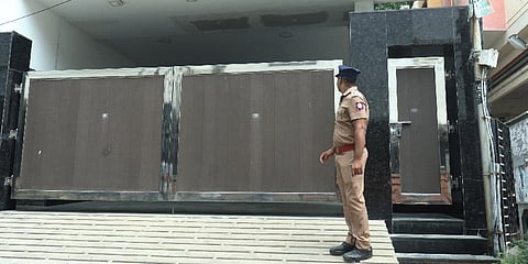 The former AIADMK MLA Sathyanarayanan seated in front of his house where the DVAC officers conducted a raid on Wednesday.