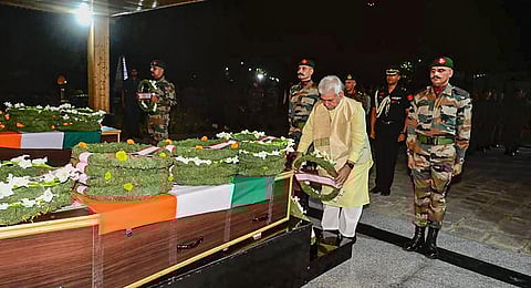 J&K Lt Governor Manoj Sinha pays homage to the mortal remains of Colonel Manpreet Singh and Major Aashish Dhonchak who were killed in a gunfight with terrorists in Anantnag district. (Photo | PTI)