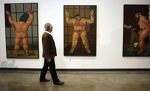 FILE - Colombian painter and sculptor Fernando Botero looks over his work at a first complete US showing of 'Art of Confrontation' at American University Museum in Washington, Nov 5, 2007. (Photo | AP