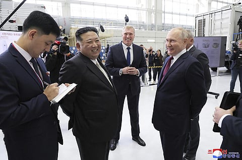 This picture shows North Korea's leader Kim Jong Un (centre R) and Russia's President Vladimir Putin (centre L) visitng the Vostochny Cosmodrome in Russia's Amur region. (Photo | AFP)