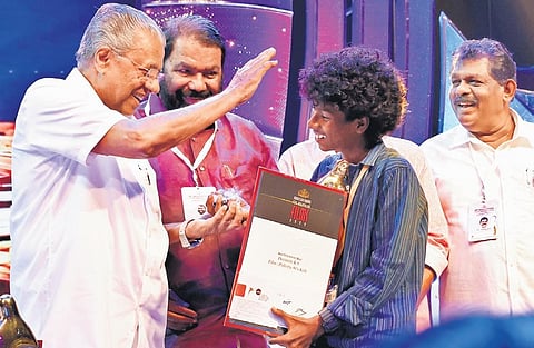 Chief Minister Pinarayi Vijayan blesses Master K S Davinci, the best child artist (boys) who acted in Pallootty 90’s Kids, at the 53rd State Film Awards distribution function. (Photo | Express)
