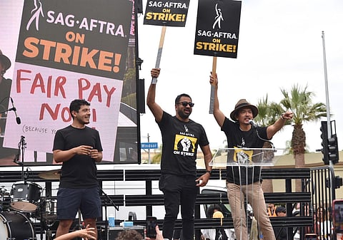 Actors Kal Penn and John Cho speak during a rally outside Paramount Pictures Studio. (Photo | AP)