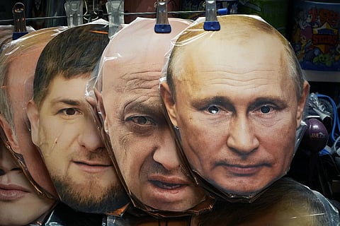 FILE - Face masks depicting Vladimir Putin, Yevgeny Prigozhin and  Ramzan Kadyrov displayed among others for sale at a souvenir shop in St Petersburg, Russia, June 4, 2023. (Photo | AP)